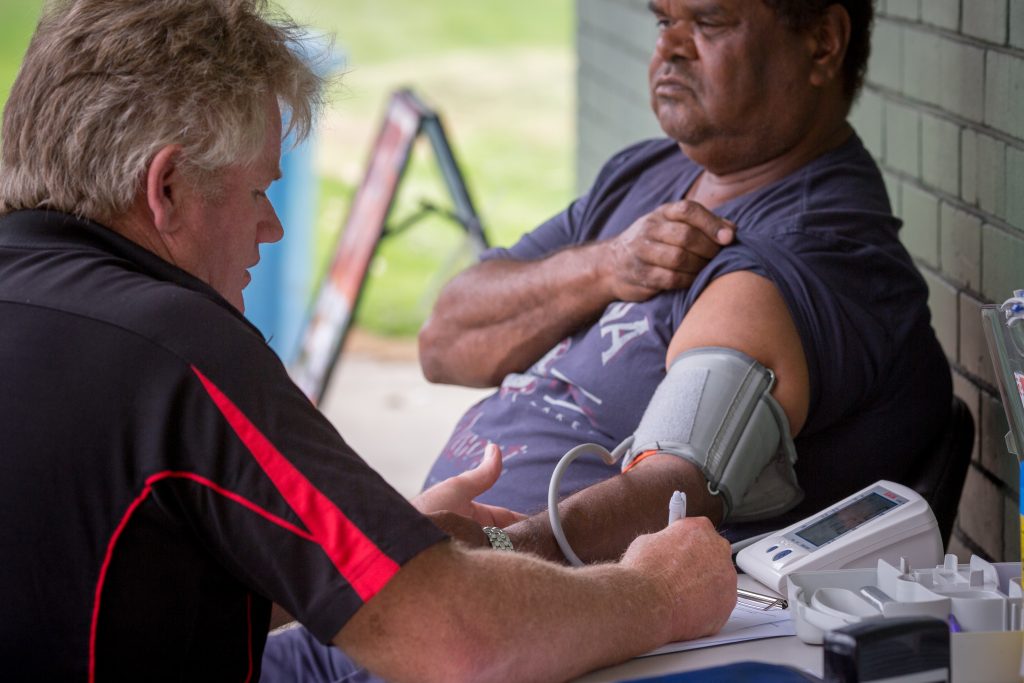 Aboriginal man having blood pressure checked